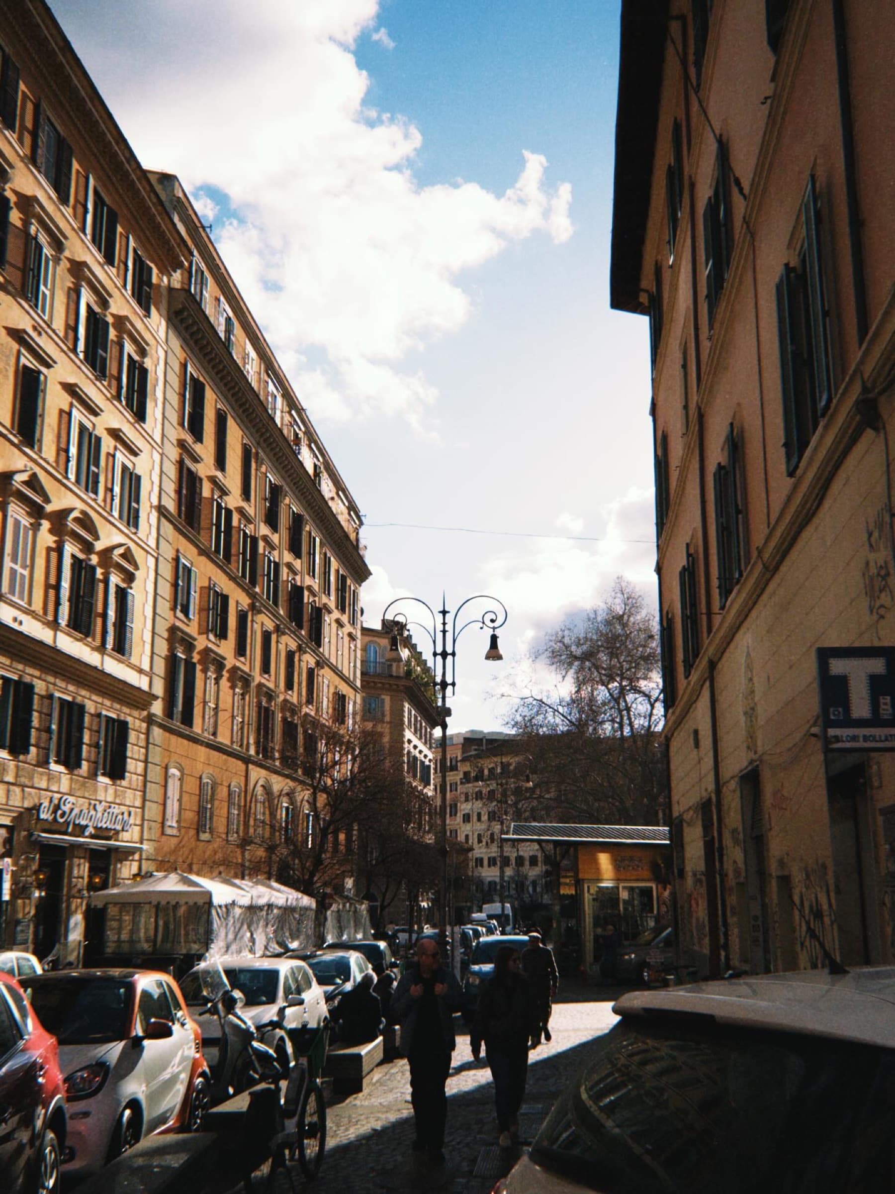 Tall apartment buildings under a bright sky