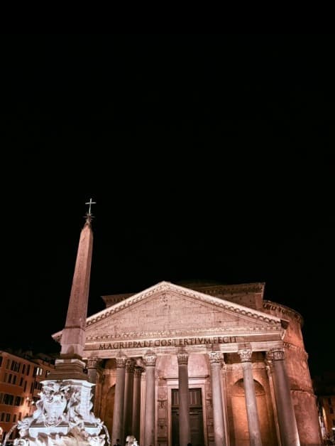 The Pantheon portico and obelisk lit against a black sky